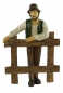 Preview: Handbemalte Krippenfigur Bauer an Zaun, ca. 11 cm, K 917-11
