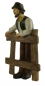 Preview: Handbemalte Krippenfigur Bauer an Zaun, ca. 11 cm, K 917-11