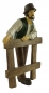 Preview: Handbemalte Krippenfigur Bauer an Zaun, ca. 11 cm, K 917-11